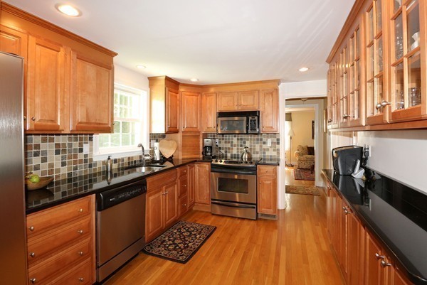 43 Boulder Brook Road Wellesley, MA 02481 - Photo 5 of 23 a kitchen with stainless steel appliances granite countertop a stove top oven a sink dishwasher a refrigerator and cabinets with wooden floor