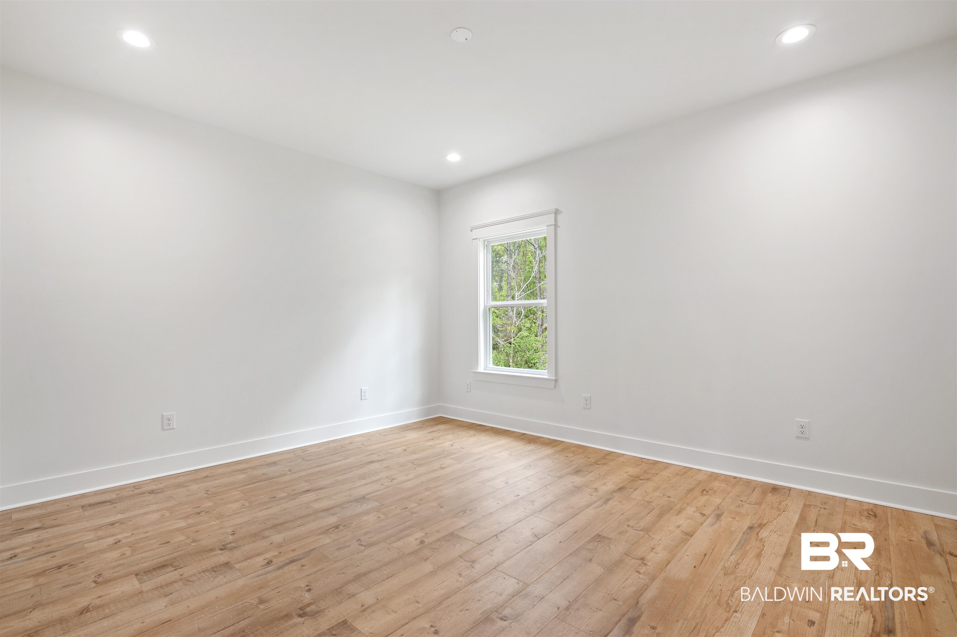 657 Island Way Gulf Shores, AL 36542 - Photo 31 of 59 Spare room featuring baseboards, light wood-style flooring, and recessed lighting