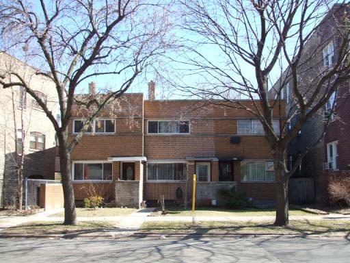 7071 North Ridge Avenue Chicago, IL 60645 - Photo 1 of 1 a front view of a house with a yard