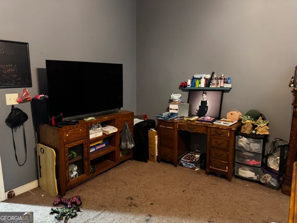 a room with furniture and a flat screen tv