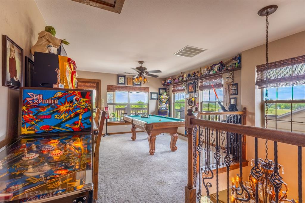 7060 Hells Gate Loop Strawn, TX 76475 - Photo 13 of 40 a view of a living room and balcony