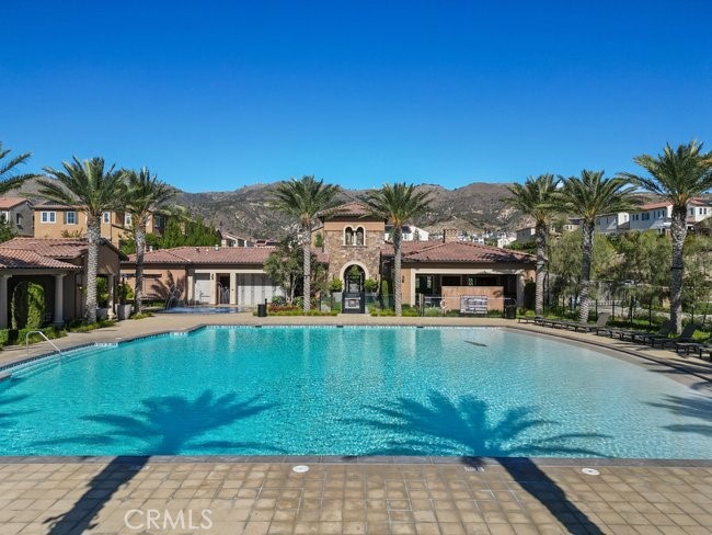 20661 West Beech Porter Ranch Porter Ranch, CA 91326 - Photo 39 of 49 Oasis ** Clubhouse featuring massive beach entry Pool, 2 Spa, Splash Area, Cabanas equipped with smart TVs and sitting area, BBQ Grills and breathtaking mountain and city view!