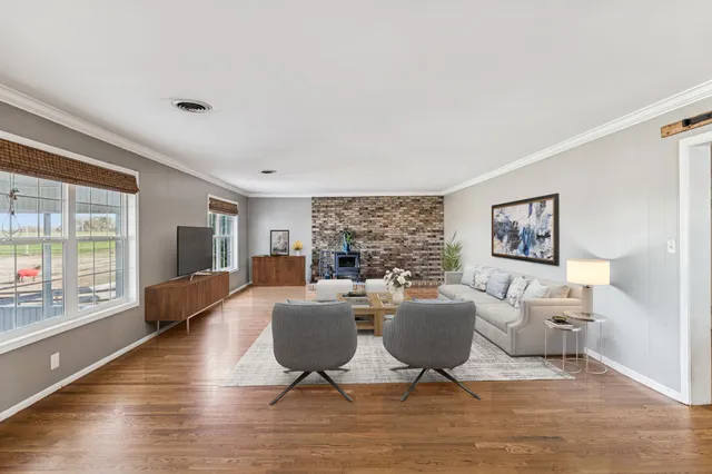 a view of an empty room and a window