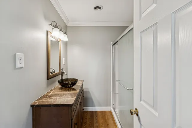 a view of a garage with a white house