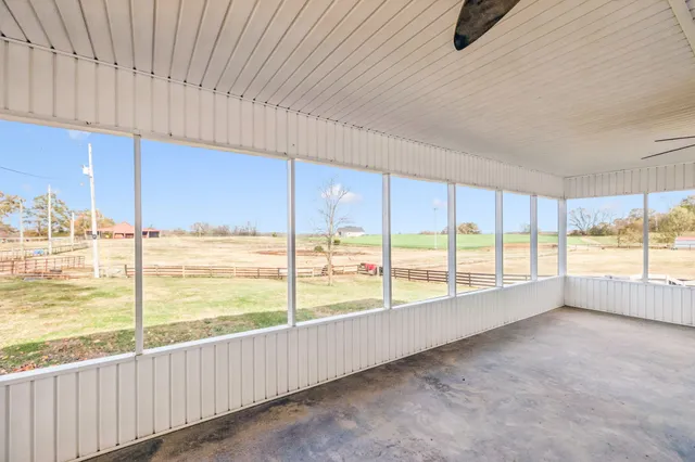 a view of a hallway with wooden floors