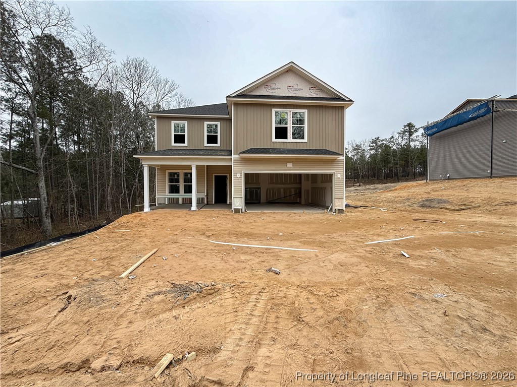 a view of a house with a yard and garage
