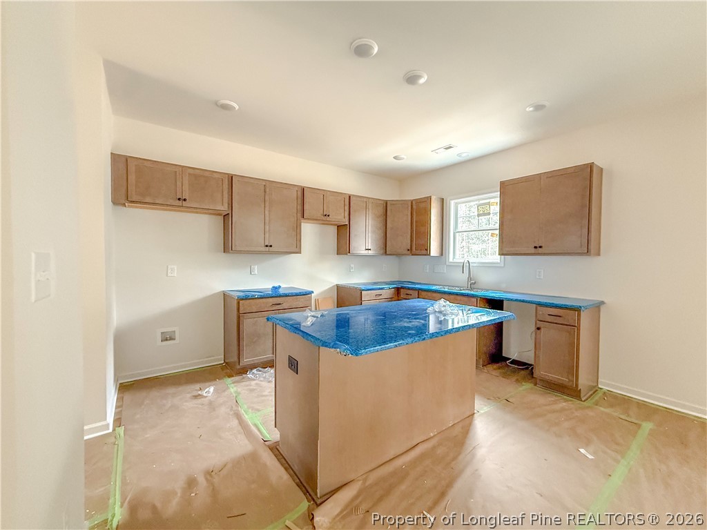 1164 Alex Baker (lot 1) Road Raeford, NC 28376 - Photo 5 of 12 a large kitchen with stainless steel appliances granite countertop a sink and cabinets