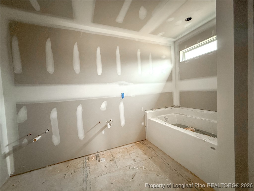 1164 Alex Baker (lot 1) Road Raeford, NC 28376 - Photo 6 of 12 a bathroom with a tub