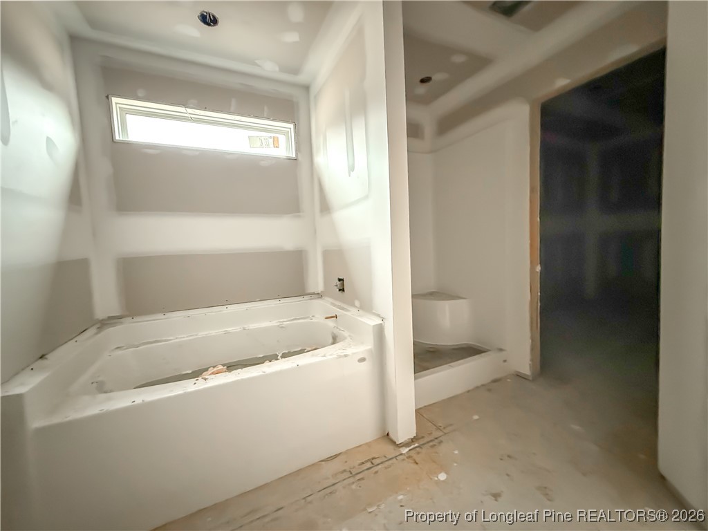 1164 Alex Baker (lot 1) Road Raeford, NC 28376 - Photo 7 of 12 a bathroom with a bathtub and a shower