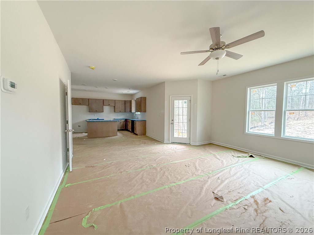 1164 Alex Baker (lot 1) Road Raeford, NC 28376 - Photo 7 of 12 a view of empty room with wooden floor and fan