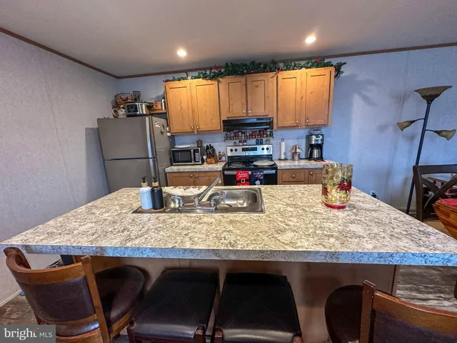a kitchen with a table and chairs