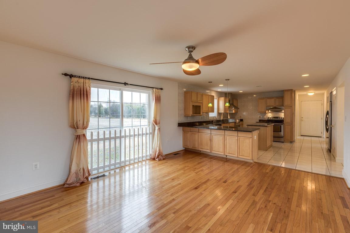 97 Swaggers Point Road Solomons, MD 20688 - Photo 3 of 28 a view of kitchen with cabinets and wooden floor