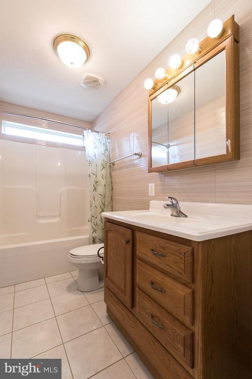 97 Swaggers Point Road Solomons, MD 20688 - Photo 21 of 28 a bathroom with a sink a toilet and shower