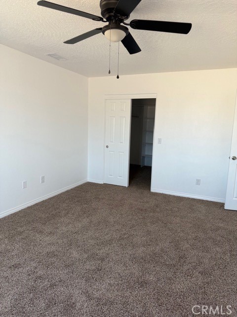 16925 Nanticoke Road Apple Valley, CA 92307 - Photo 21 of 87 a view of a big room with a ceiling fan