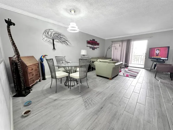 a kitchen with sink cabinets and white appliances