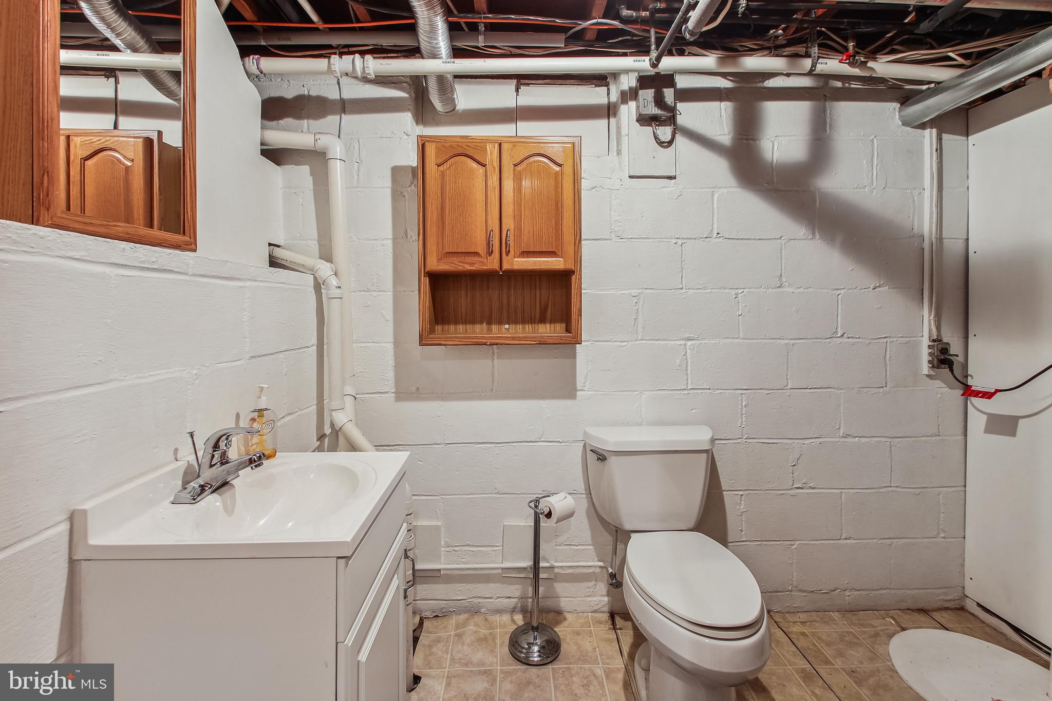 1519 Long Point Road Pasadena, MD 21122 - Photo 38 of 42 Lower level 1/2 bath and utility area