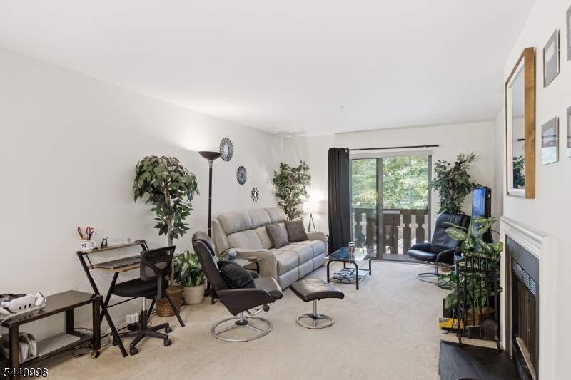 609 Mark Twain Way Mahwah, NJ 07430 - Photo 10 of 40 a living room with furniture and a potted plant