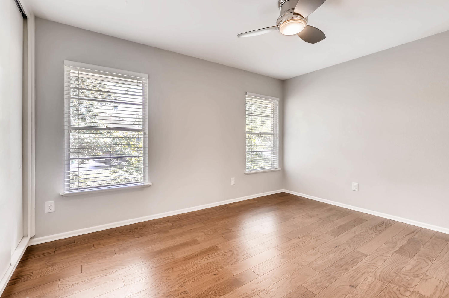 446 Pike Road San Antonio, TX 78209 - Photo 19 of 28 Hardwood floors and generous windows create a light and inviting atmosphere in this sizable room.