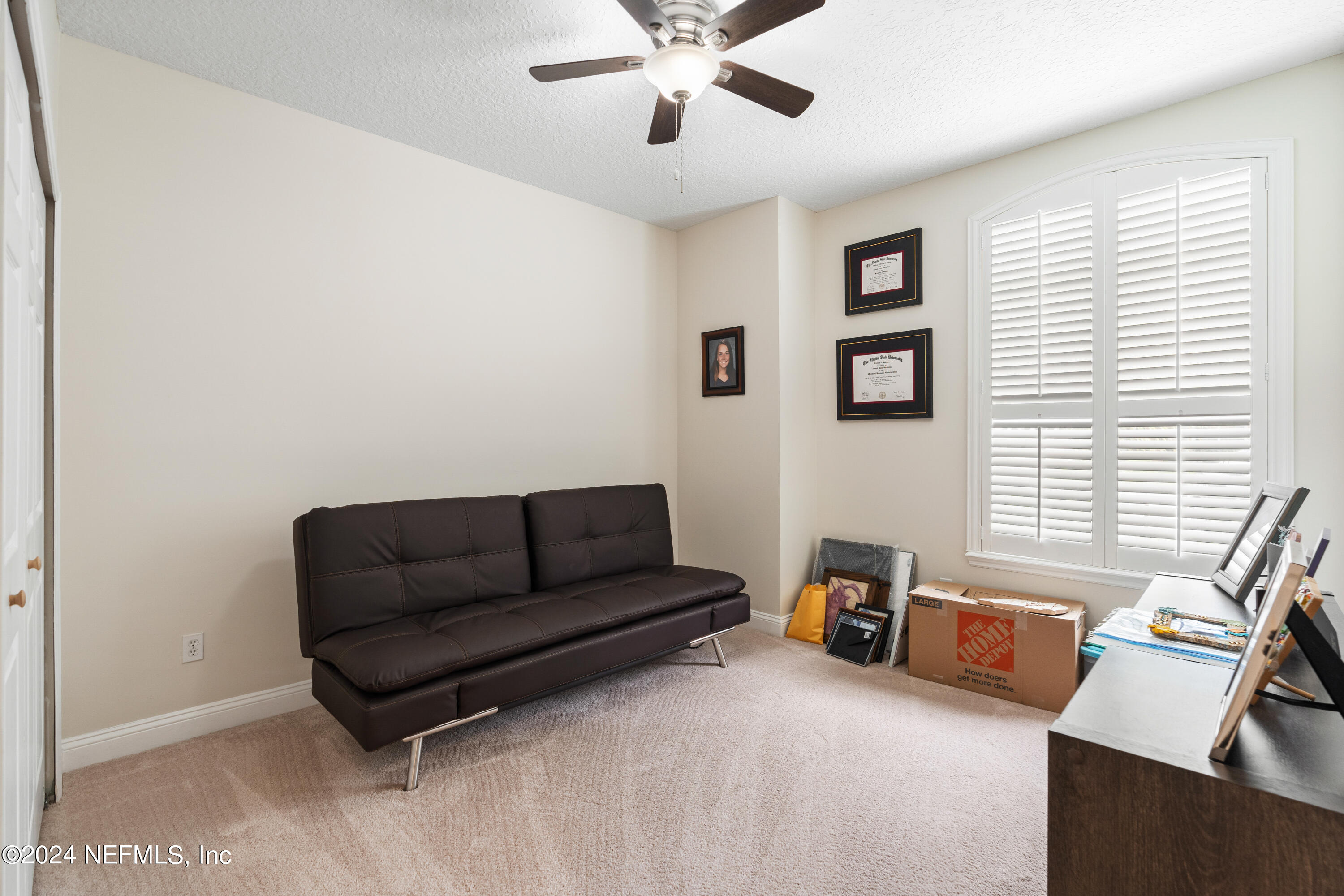 1144 Sandlake Road St. Augustine, FL 32092 - Photo 11 of 15 a living room with furniture and a window