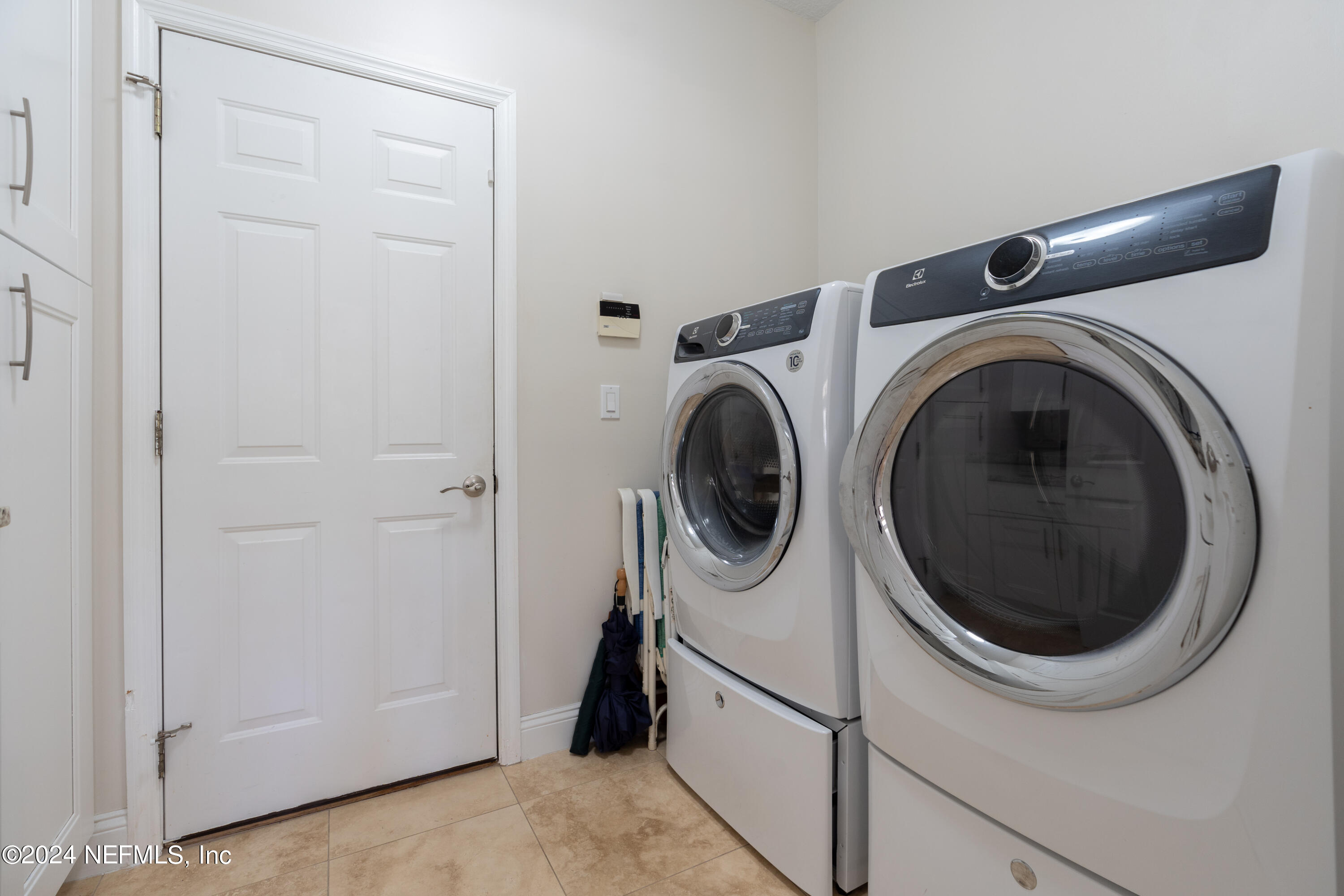 1144 Sandlake Road St. Augustine, FL 32092 - Photo 12 of 15 a utility room with dryer and washer