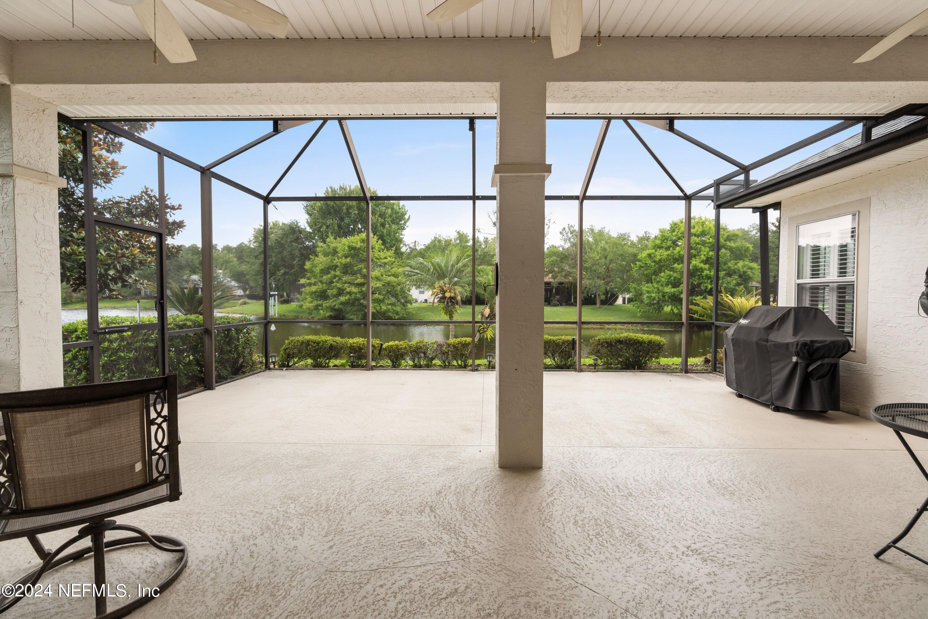 1144 Sandlake Road St. Augustine, FL 32092 - Photo 15 of 15 a bed sitting in a bedroom next to a window