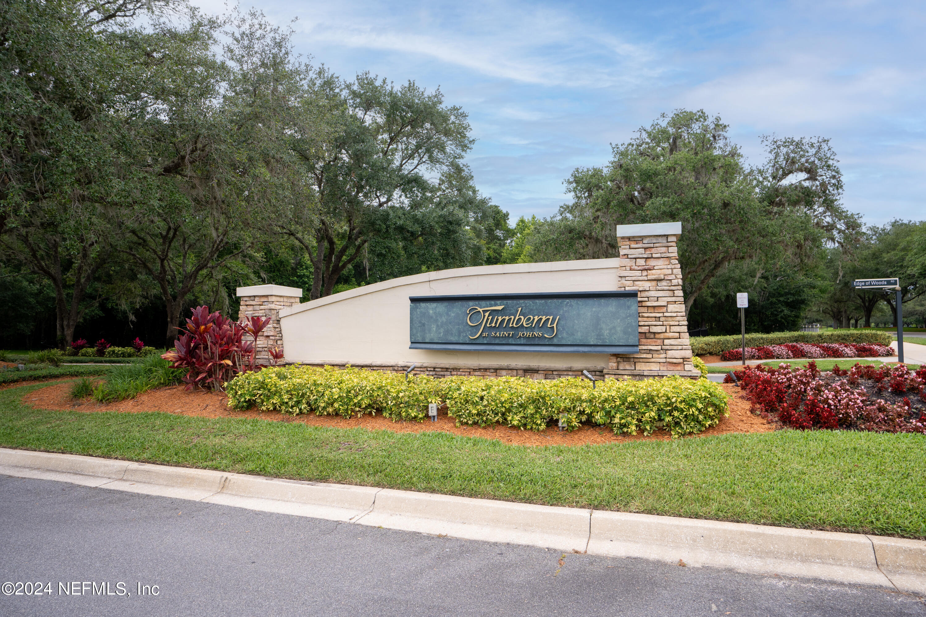 1144 Sandlake Road St. Augustine, FL 32092 - Photo 2 of 15 a view of a park that has a sign board large trees