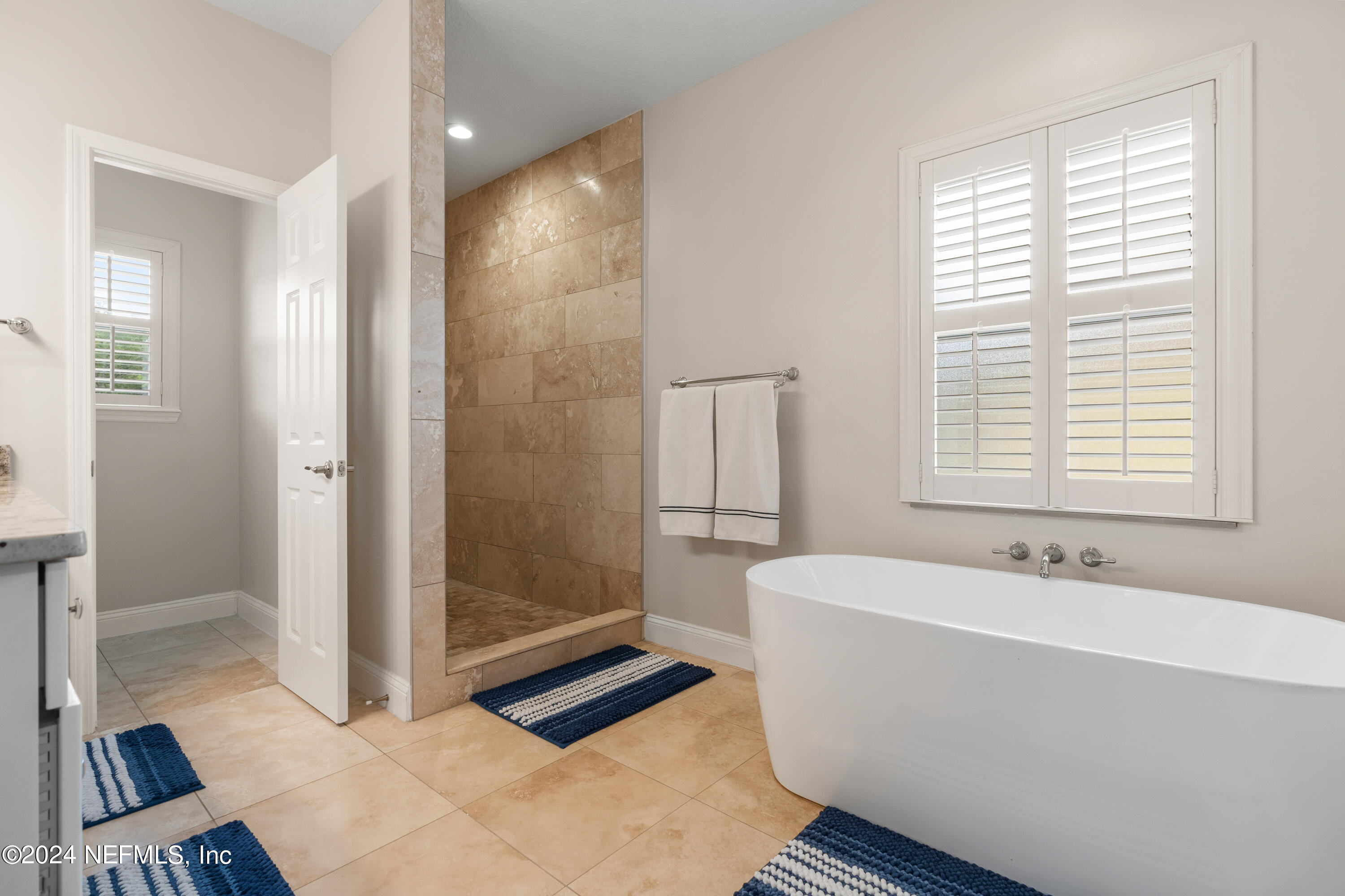 1144 Sandlake Road St. Augustine, FL 32092 - Photo 7 of 15 a bathroom with a bathtub and a sink