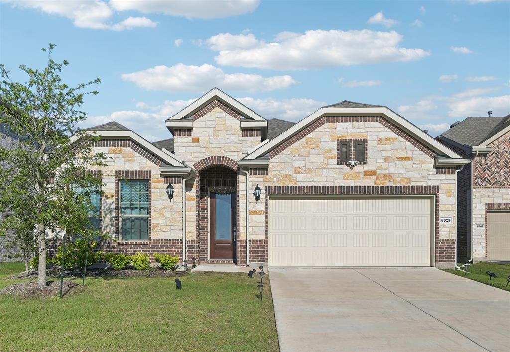 8629 Red Fox Trail McKinney, TX 75071 - Photo 1 of 1 a front view of a house with a yard