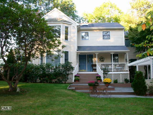 237 Porters Hill Road Monroe, CT 06468 - Photo 1 of 1 a front view of house with yard and green space