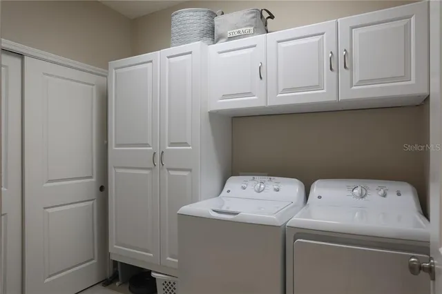 a utility room with dryer and washer