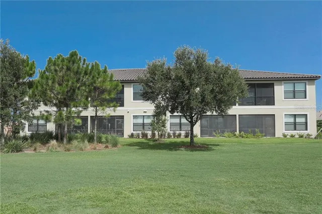 a front view of house with a garden