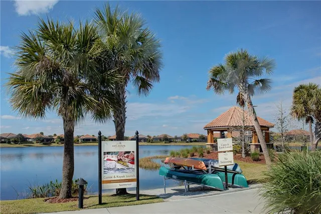 a view of a yard with a table and chairs
