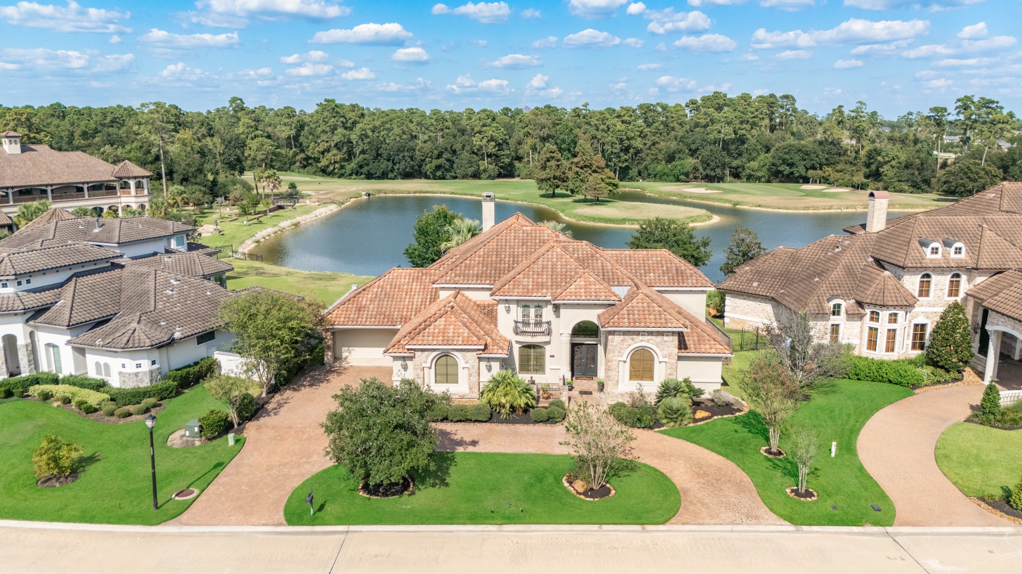 26 Post Shadow Estate Drive Spring, TX 77389 - Photo 2 of 49 Welcome to this beautiful estate home on a breathtaking oversized lot with waterfront and golf course views. 26 Post Shadow Estates has it all!