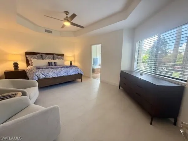 a bedroom with bed and window