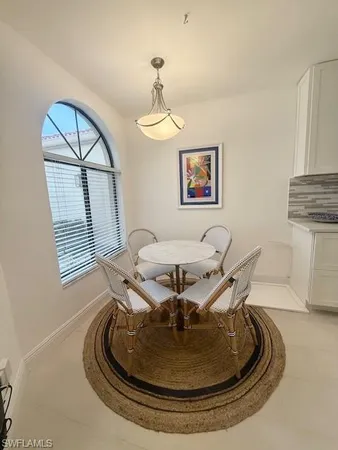 a view of a livingroom with furniture and a window