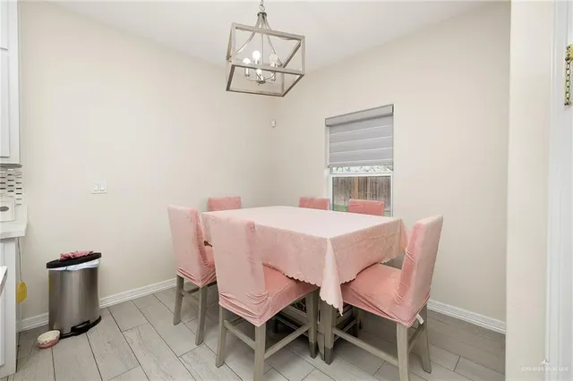 a dining room with furniture and window