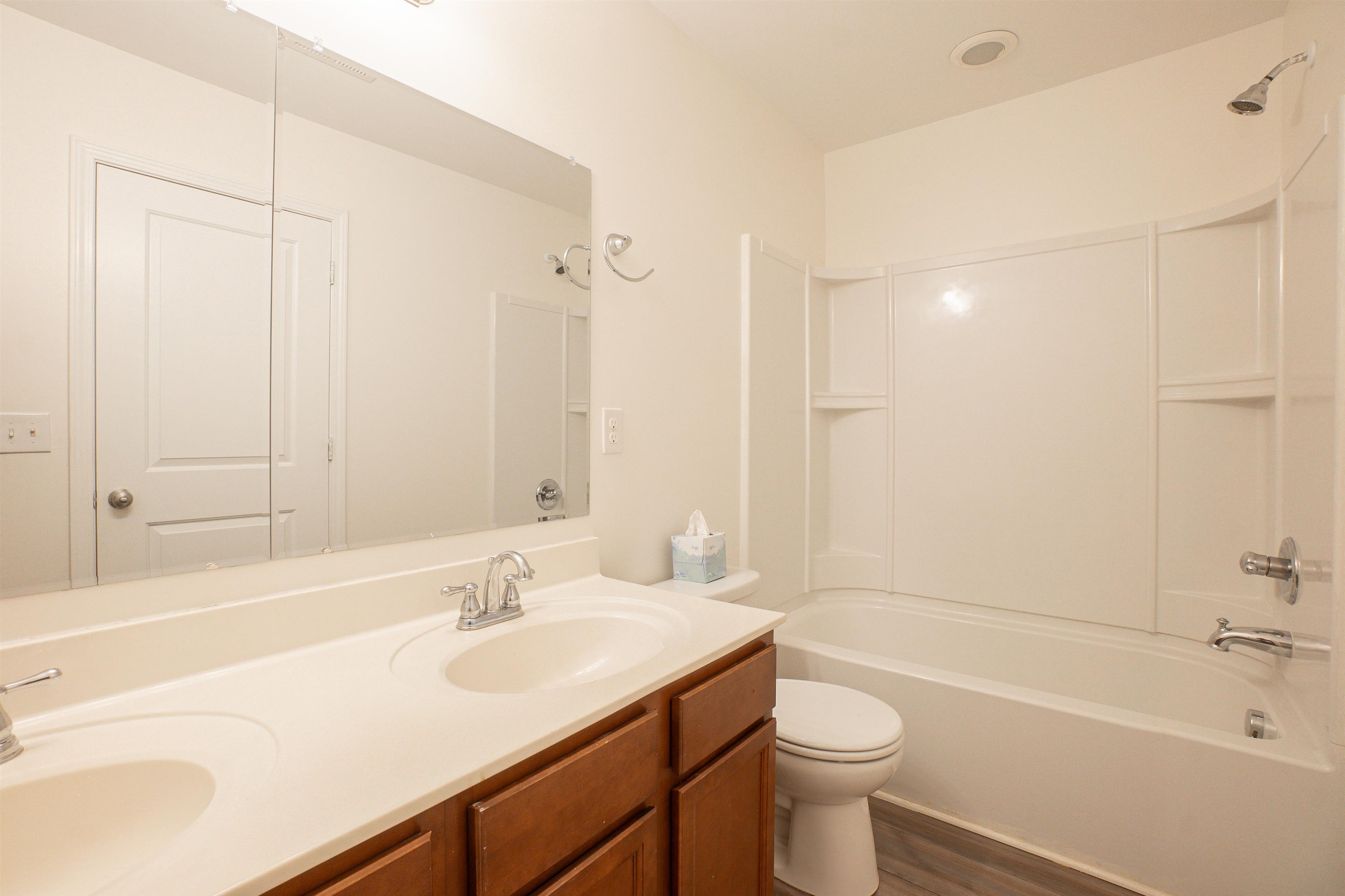 1752 Musket Trail Sumter, SC 29150 - Photo 26 of 37 Full bathroom featuring double vanity, bathtub / shower combination, and dark wood finished floors