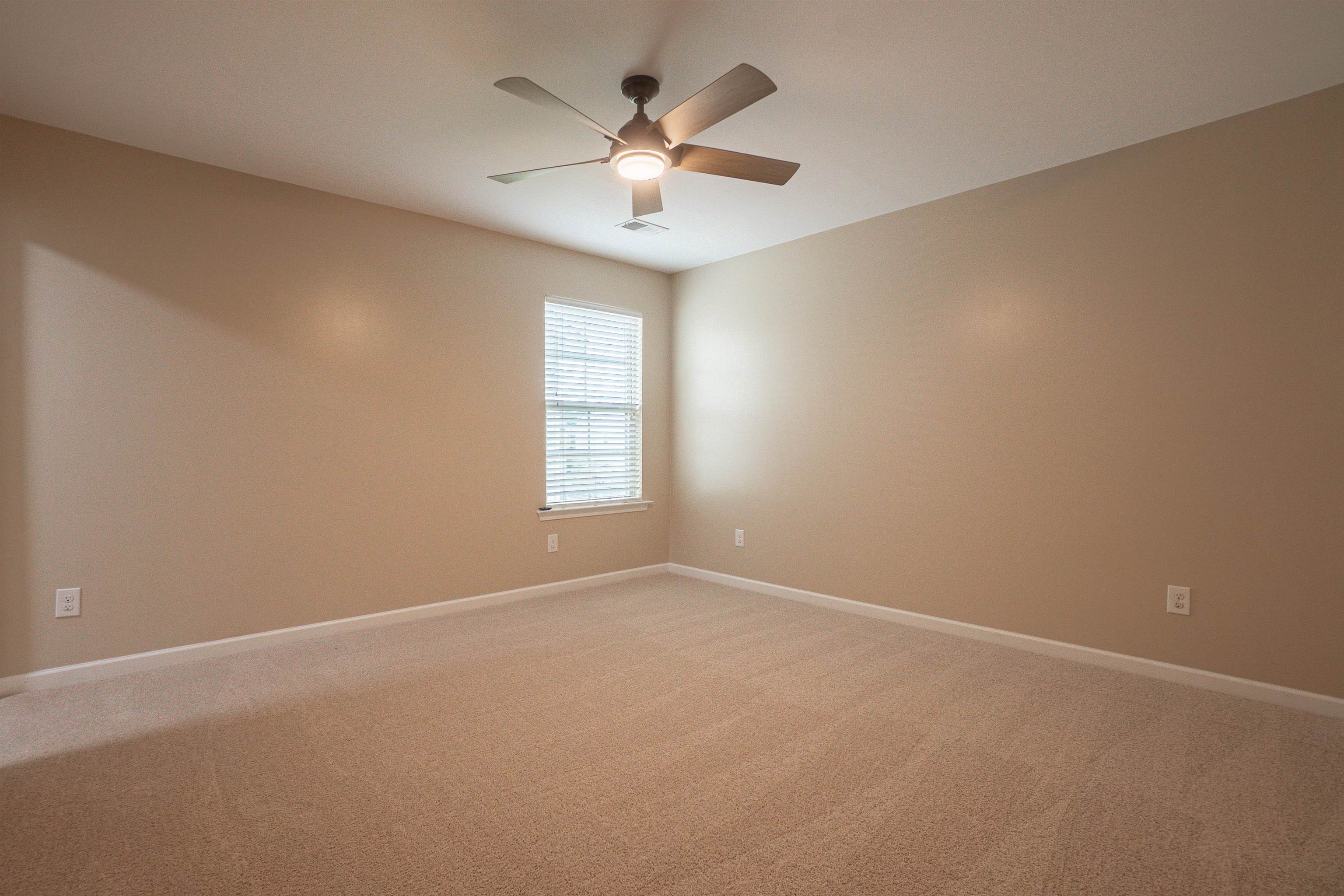 1752 Musket Trail Sumter, SC 29150 - Photo 28 of 37 Empty room featuring light colored carpet and ceiling fan