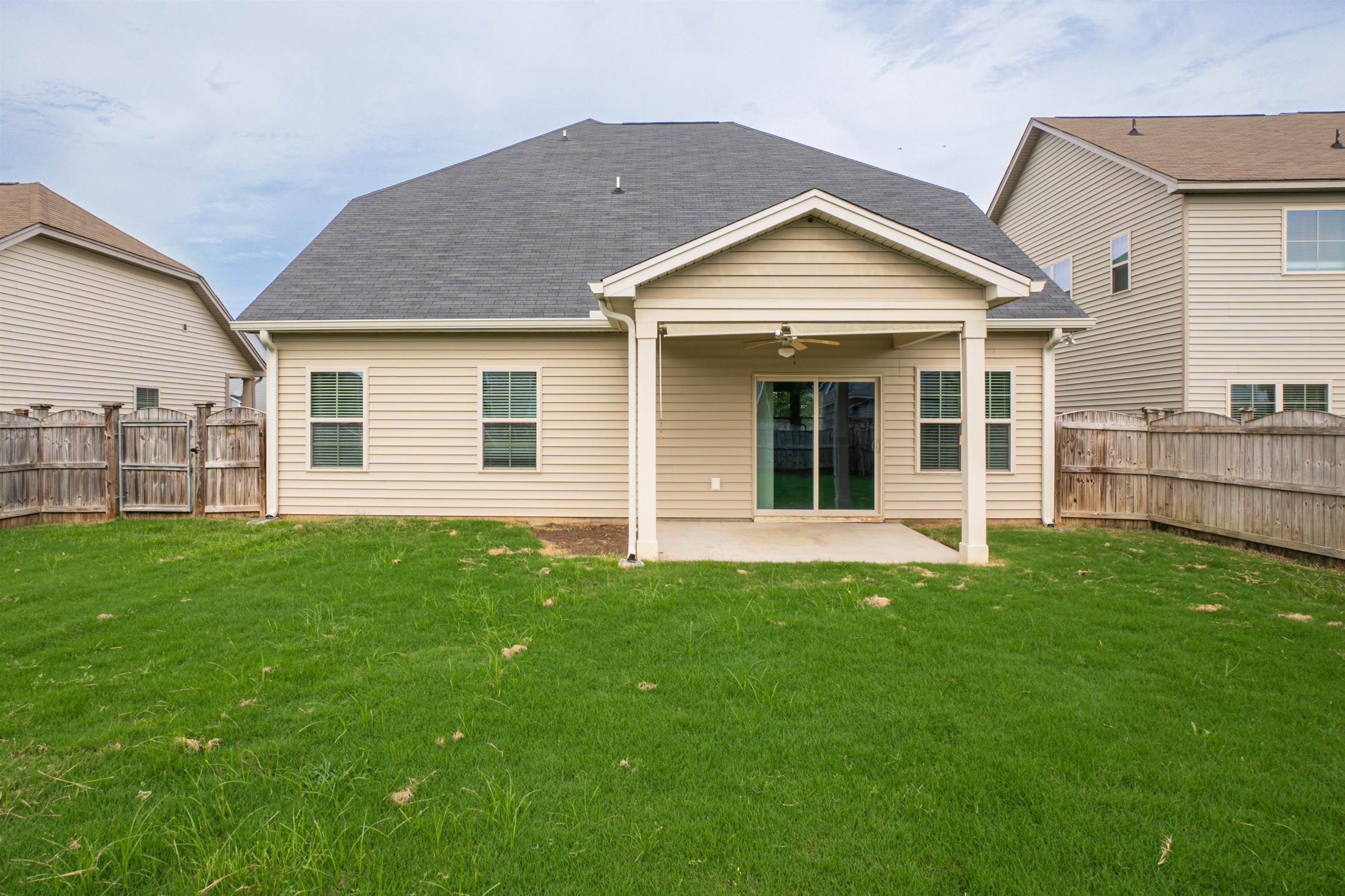 1752 Musket Trail Sumter, SC 29150 - Photo 3 of 37 Back of house featuring a ceiling fan, a patio area, a fenced backyard, and roof with shingles