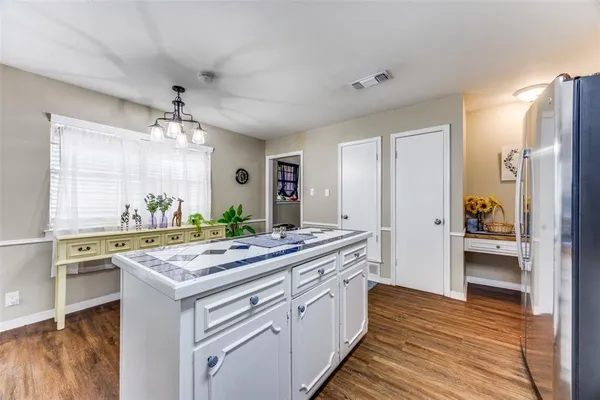a kitchen with a sink stove and refrigerator