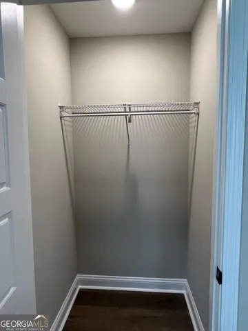 a kitchen with a sink a refrigerator and cabinets