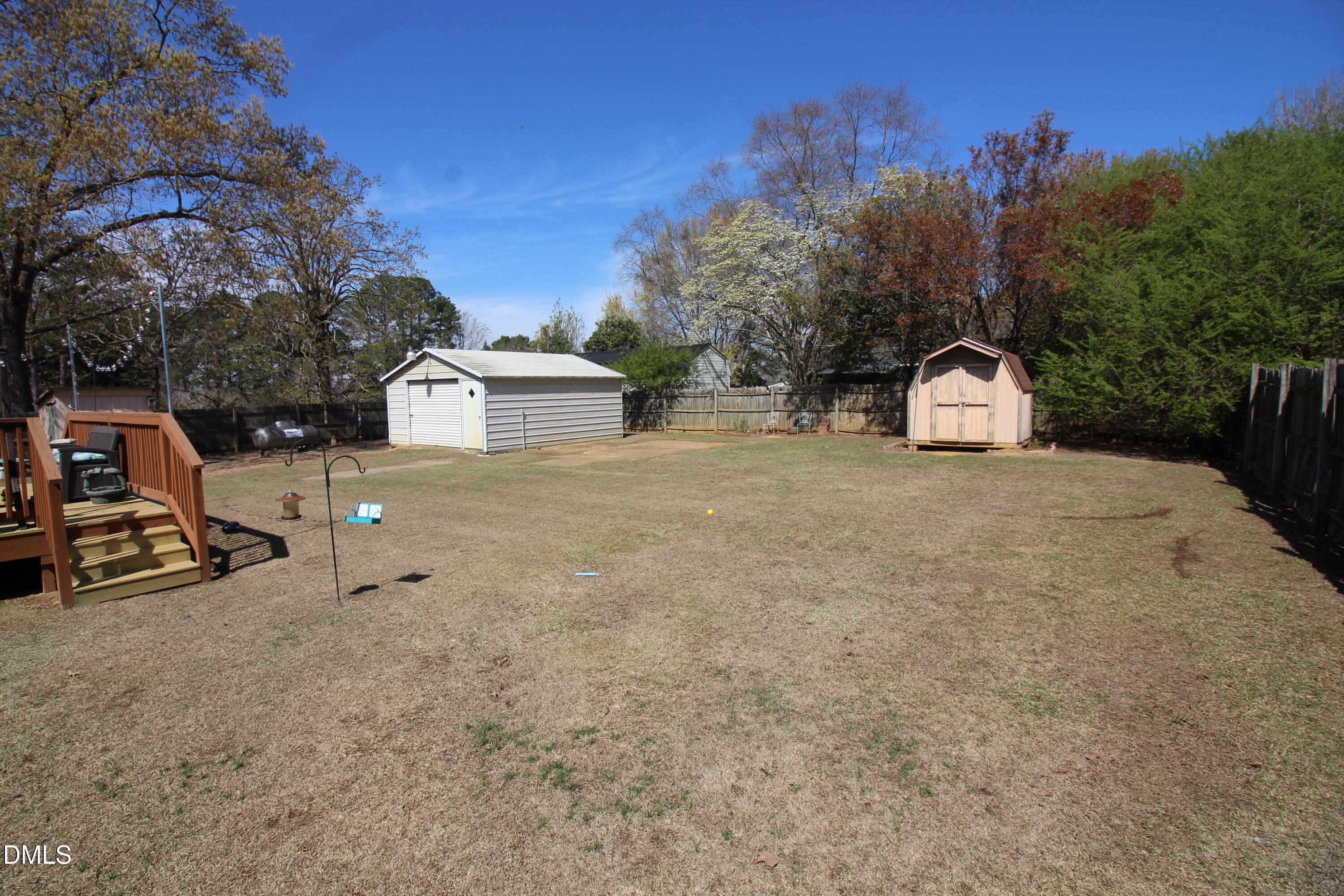 56 Ash Street Coats, NC 27521 - Photo 12 of 28 a view of a house with a yard and sitting area