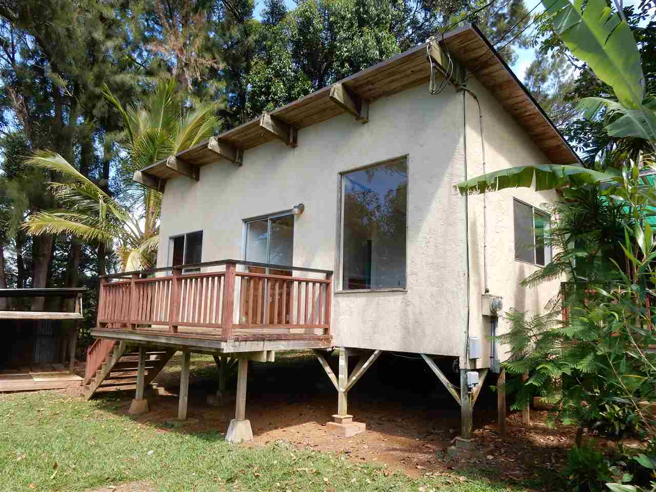 1661 West Kuiaha Road Haiku, HI 96708 - Photo 4 of 16 a view of a house with backyard and sitting area