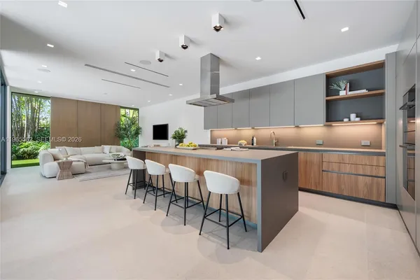 a kitchen with a sink and white cabinets