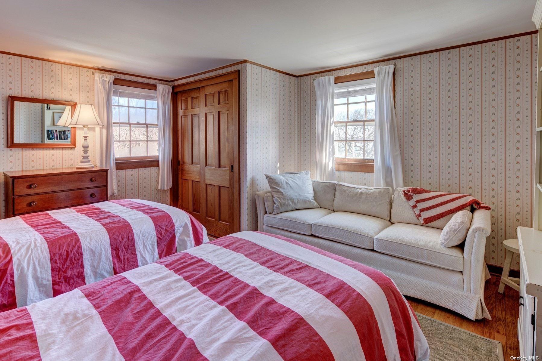 199 Old Harbor Road New Suffolk, NY 11956 - Photo 14 of 15 a bedroom with two beds and a window