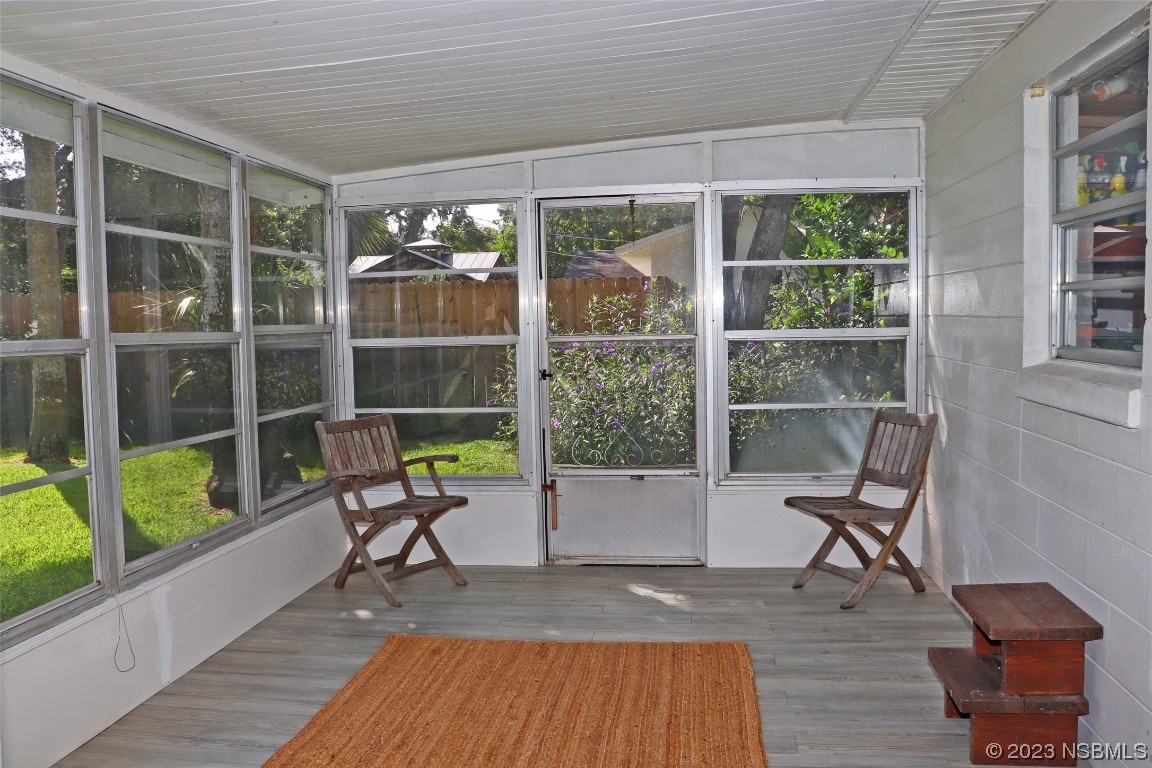 10 Raintree Drive Port Orange, FL 32127 - Photo 11 of 31 a view of a room with a table and chairs