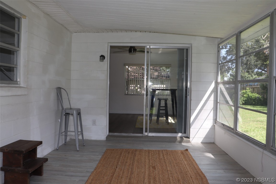 10 Raintree Drive Port Orange, FL 32127 - Photo 12 of 31 a view of gallery with wooden floor and a rug