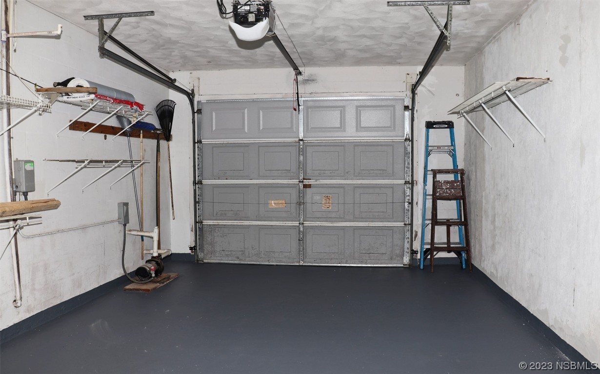10 Raintree Drive Port Orange, FL 32127 - Photo 23 of 31 a view of walk in closet with clothes and shoes