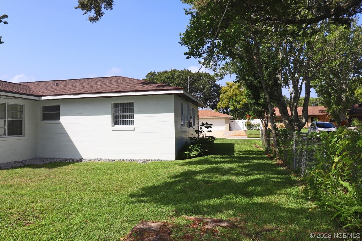 10 Raintree Drive Port Orange, FL 32127 - Photo 27 of 31 a house view with a garden space