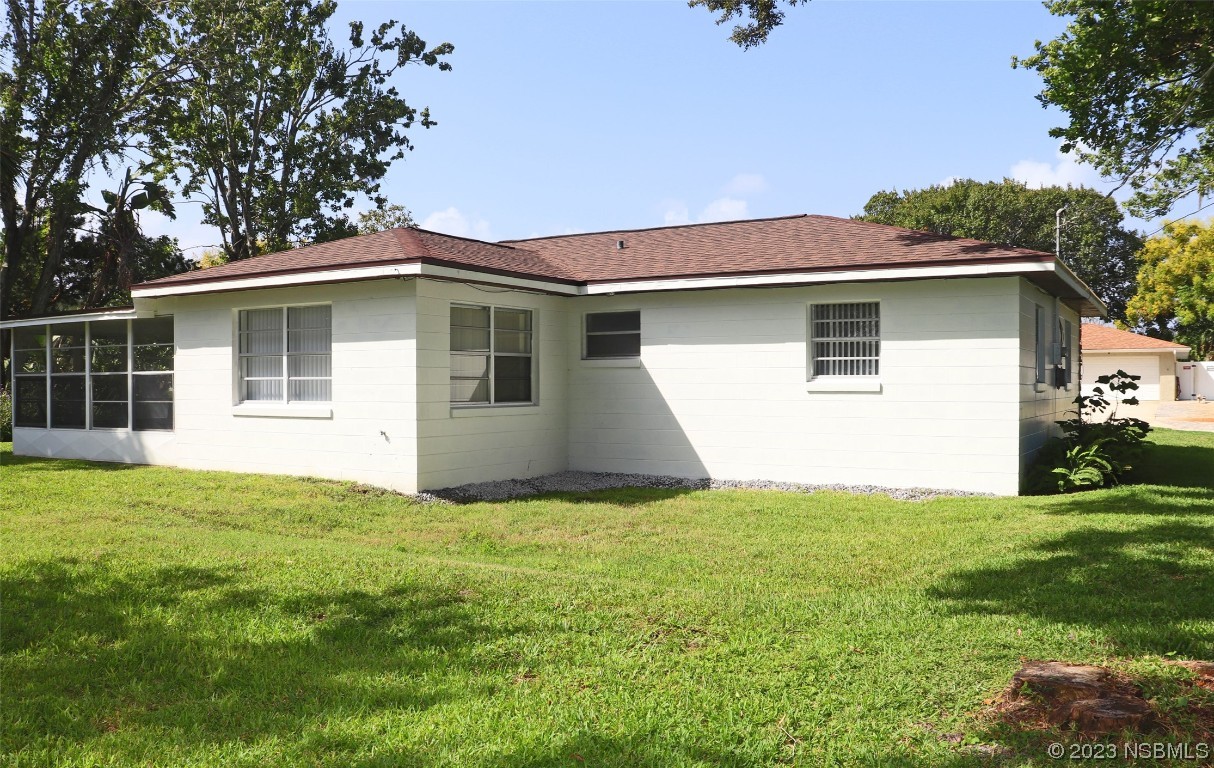 10 Raintree Drive Port Orange, FL 32127 - Photo 29 of 31 a view of a house with a yard